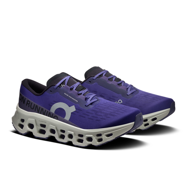 Purple running shoes with white sole on a white background