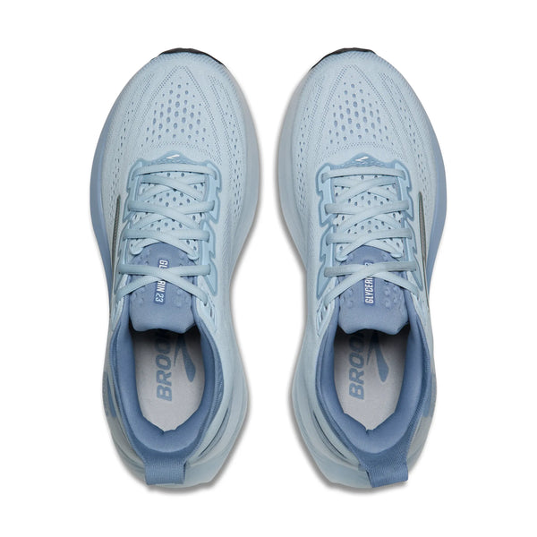 Pair of light blue running shoes on a white background