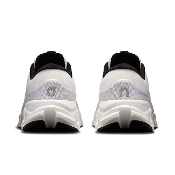 A pair of white and black On running shoes shown from the back, featuring the signature On logo on the heel and a chunky white and black sole, set against a plain white background.