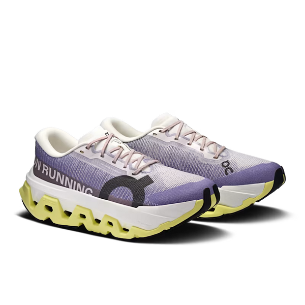Pair of running shoes with purple and white design on a white background