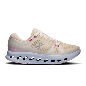 Beige running shoe with white sole on a white background