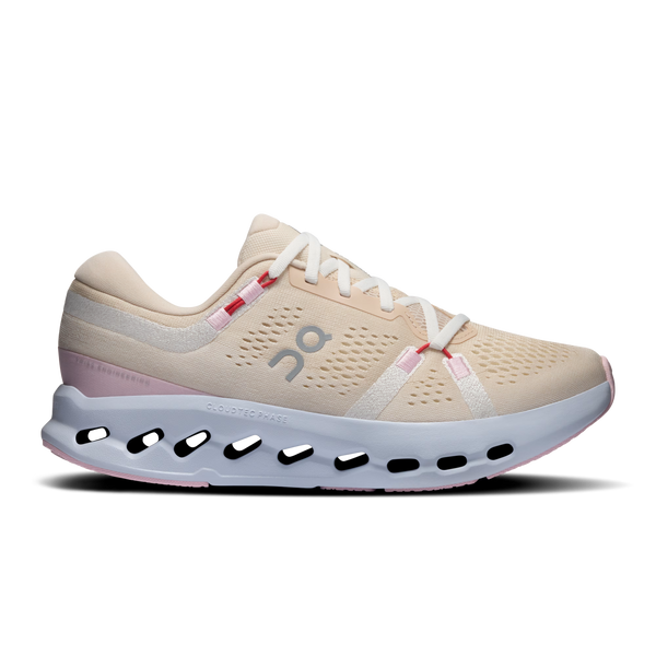 Beige running shoe with white sole on a white background