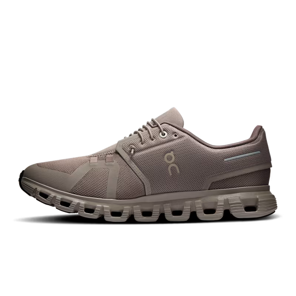 A taupe brown running shoe by On, featuring a breathable mesh and synthetic upper, matching laces, and a distinctive cushioned sole, shown against a plain white background.
