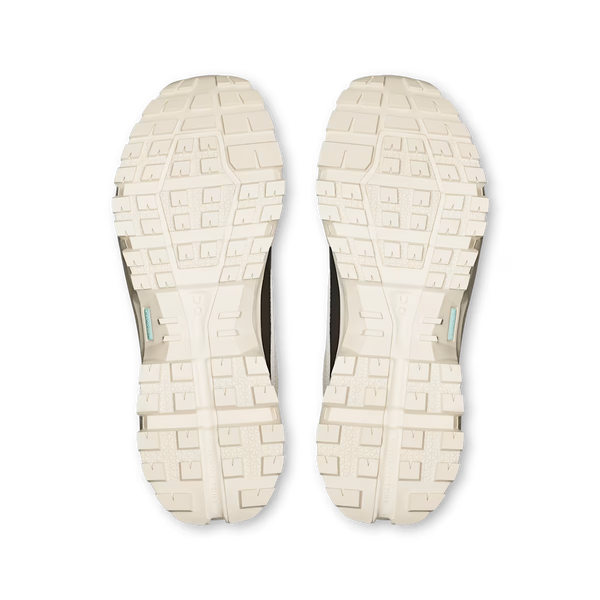 Grey and cream hiking shoe on a white background