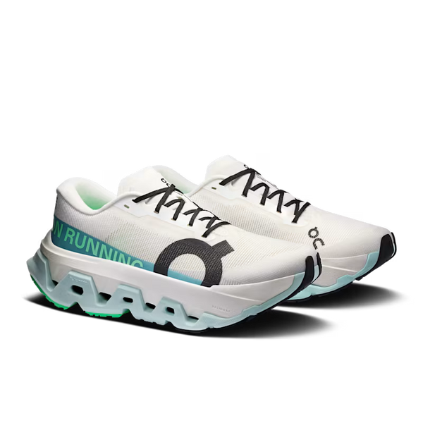 A pair of On running shoes in white, featuring a chunky translucent sole, black laces, a black circular logo, and mint green accents on the side and heel.