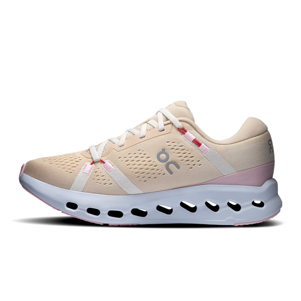 Beige running shoe with white sole on a white background