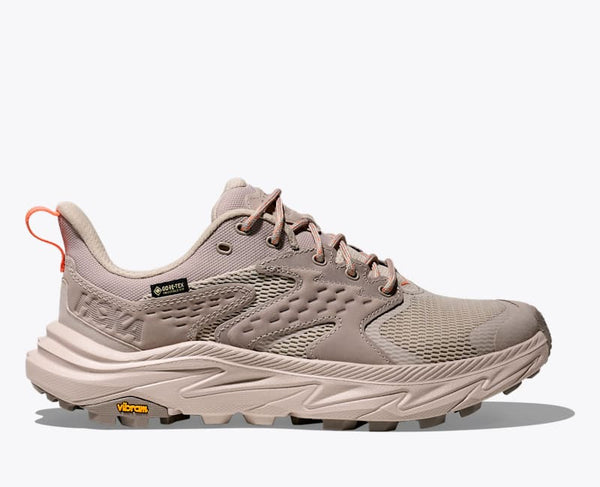 Beige hiking shoe with brand logo on a white background