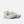 A pair of New Balance running shoes in a light cream and off-white colorway with dark gray 'N' logos and purple accents on the midsole and outsole, shown against a light gray background.