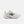 A New Balance running shoe in white and pale yellow-green, featuring a prominent black 'N' logo on the side, a thick cushioned sole, and 'FAIRLIFE' text on the midsole, set against a light gray background.
