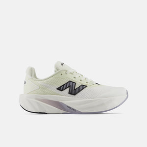 A New Balance running shoe in white and pale yellow-green, featuring a prominent black 'N' logo on the side, a thick cushioned sole, and 'FAIRLIFE' text on the midsole, set against a light gray background.