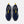 A pair of New Balance athletic sneakers shown from a top-down view on a light gray background. The shoes are primarily navy blue with bright yellow accents on the pull tabs, laces, and side stripes, and a white midsole.