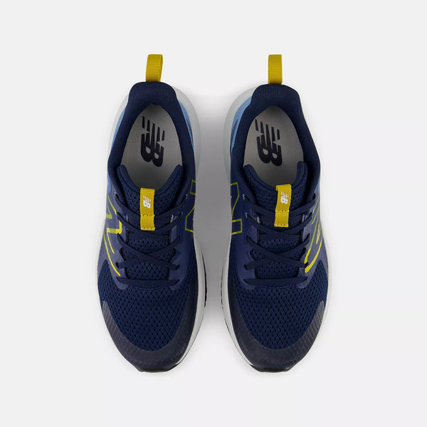 A pair of New Balance athletic sneakers shown from a top-down view on a light gray background. The shoes are primarily navy blue with bright yellow accents on the pull tabs, laces, and side stripes, and a white midsole.