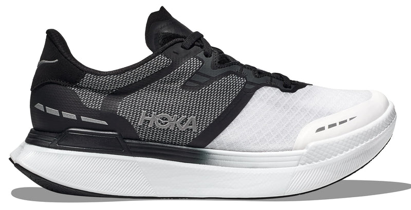 Lateral view of the Unisex Transport X by HOKA in the color Black / White