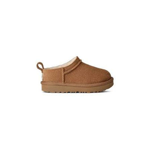 Toddle tan slipper on a white background