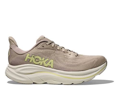 Beige and white running shoe on a white background