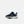 A navy blue New Balance sneaker for kids, featuring a textured navy upper, a light blue mesh heel panel, a prominent yellow 'N' logo, and a thick white midsole.