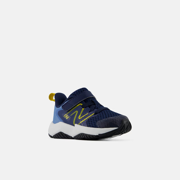 A toddler's New Balance sneaker in navy blue, light blue, and yellow, shown from a side profile on a light gray background.