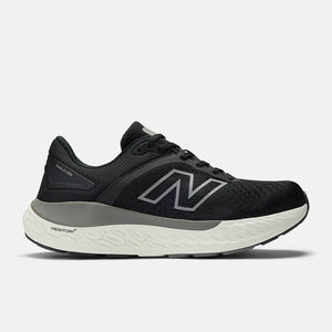 Black running shoe with white sole on a light gray background
