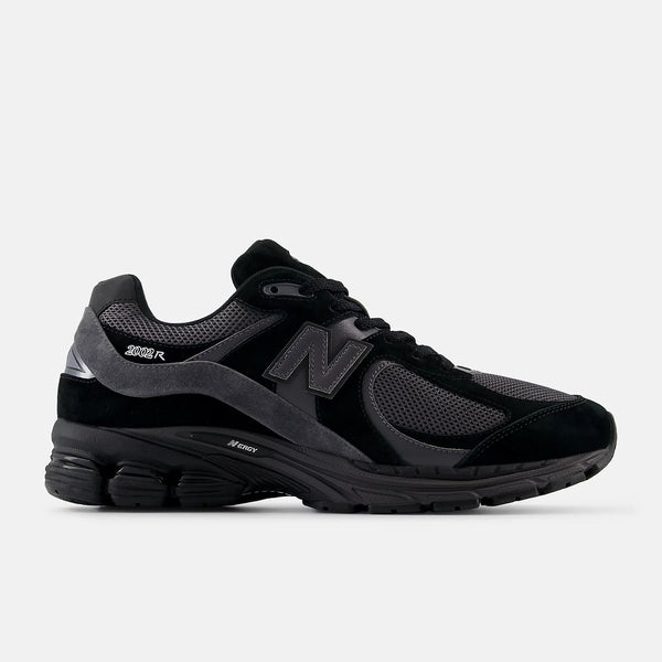 Black athletic shoe with gray accents on a white background