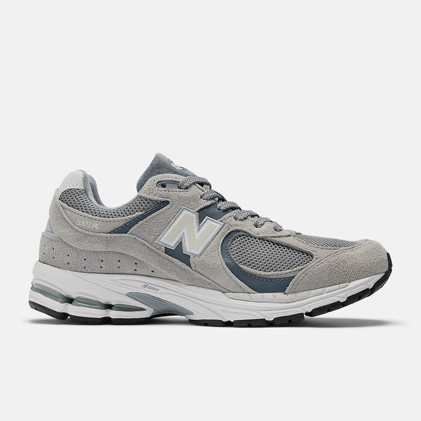 Gray running shoe with New Balance logo on a white background