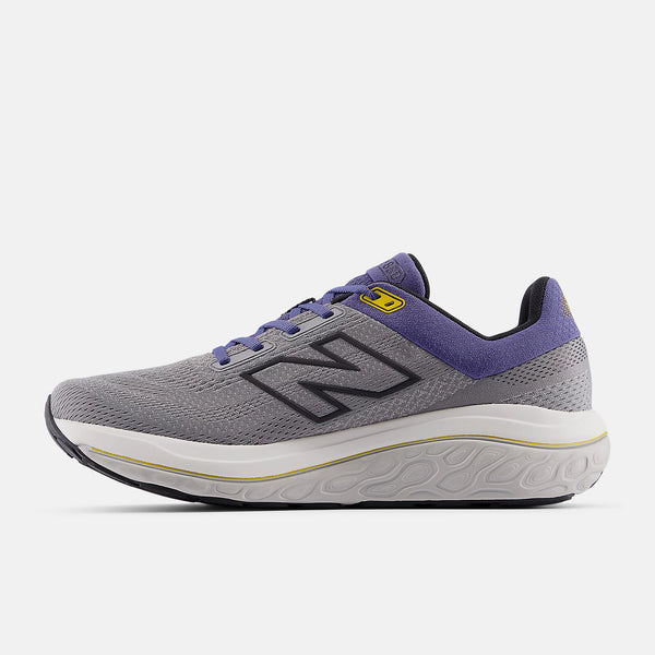 The medial side of a NB 860V14 has a 2 tone midsole with half being white and the other half grey.