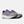 A pair of new balance shoes with blue laces and a white midsole.