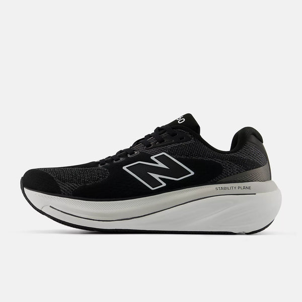 Black and white athletic shoe with red accents on a white background