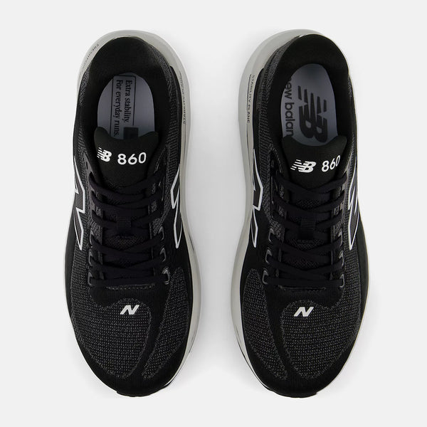 Black New Balance 860 sneakers on a white background