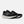 Black running shoes with white soles on a light gray background