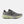 Gray running shoe with green sole on a white background