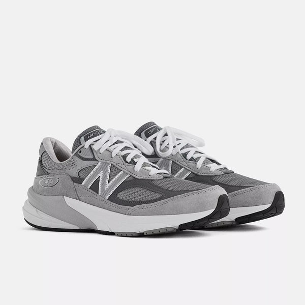 Gray sneakers with white soles on a light gray background