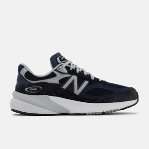 Navy and gray 990v6 sneaker with New Balance logo on a white background