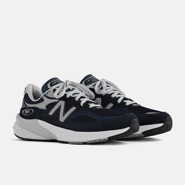 Pair of navy and gray sneakers on a white background