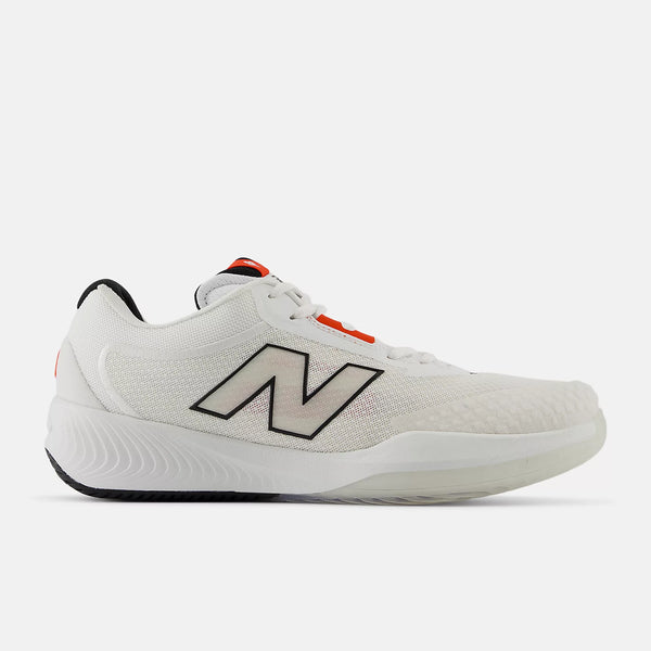 A white New Balance athletic shoe shown from the side profile against a light gray background. The shoe features a white mesh upper, a prominent gray 'N' logo outlined in black, a white midsole, and small orange accents near the laces and heel.