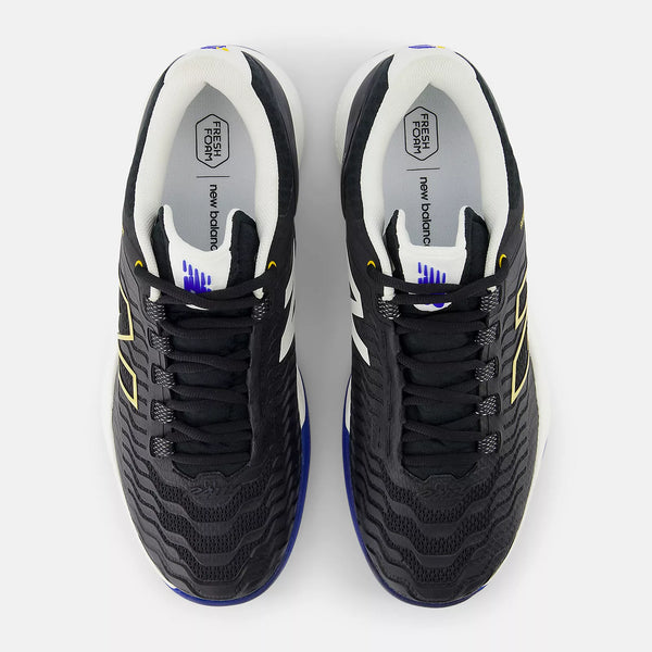 A pair of New Balance running shoes shown from a top-down view on a light gray background. The shoes are primarily black with white side stripes, a white collar, and blue and yellow accents.