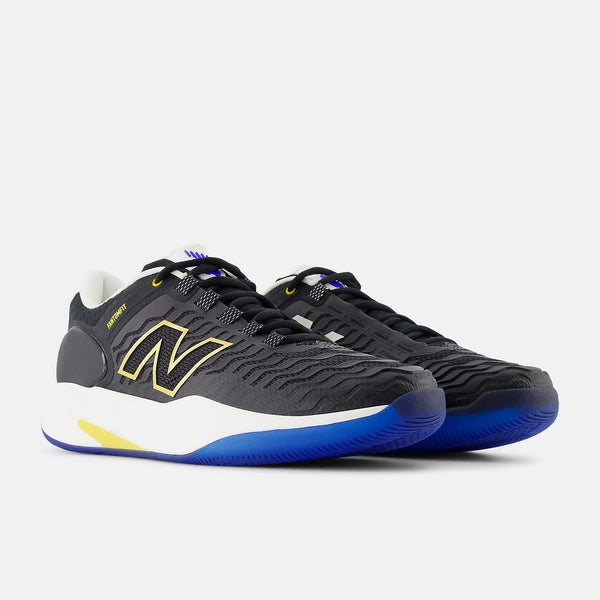A pair of New Balance 530 athletic sneakers in black, featuring a textured black mesh upper, a prominent yellow 'N' logo on the side, a white midsole, and a vibrant blue outsole.