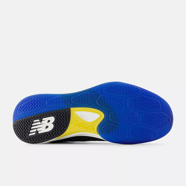 The outsole of a New Balance athletic shoe, featuring a vibrant blue tread pattern, a black heel section with a white 'NB' logo, and a bright yellow accent piece.