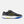 A New Balance court shoe in black with a textured pattern, featuring a yellow outlined 'N' logo, yellow 'FALCONET' text, a white midsole, and blue and yellow outsole accents, shown against a light gray background.