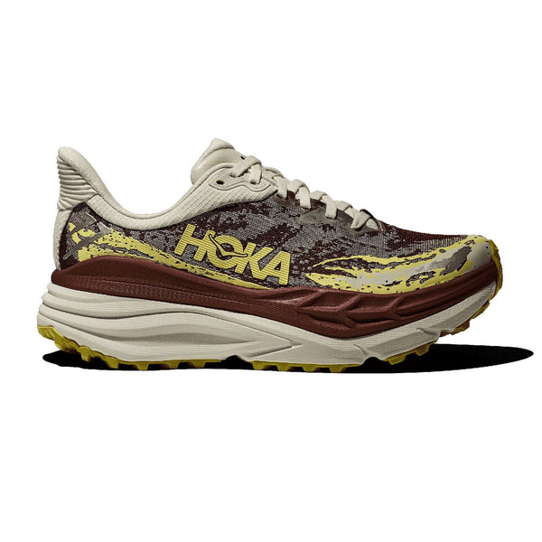 Hoka running shoe with camouflage pattern and brown sole on a white background