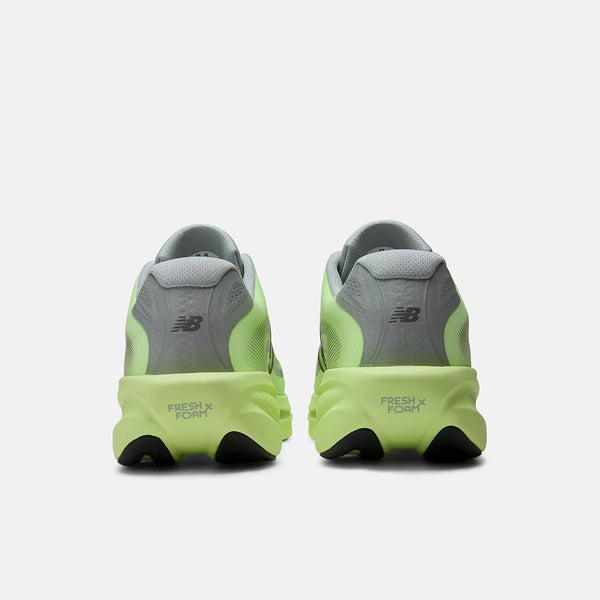 Pair of green and gray running shoes on a white background