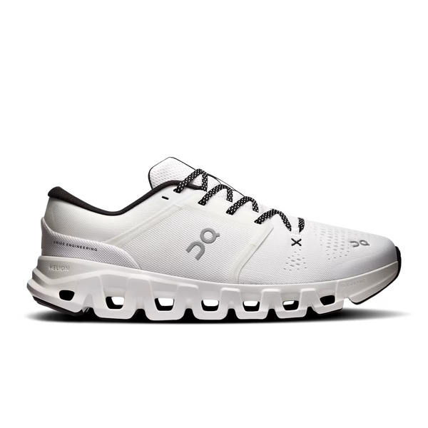 White and black gym shoe with black laces on a white background