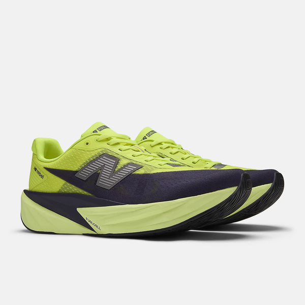 A pair of new balance running shoes with a neon green upper and matching laces.