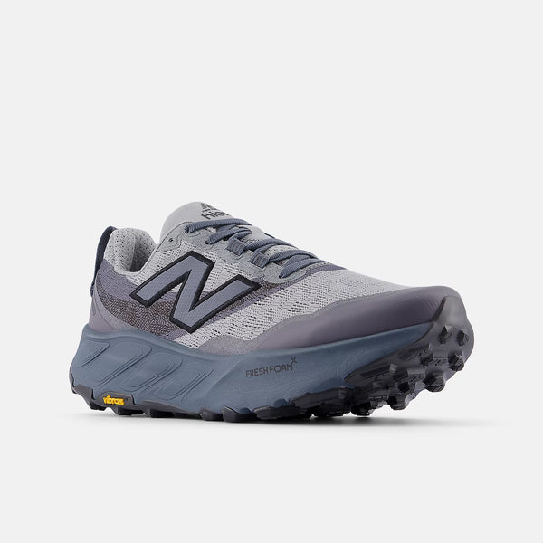 Gray and black running shoe with New Balance logo on a white background