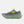 Gray running shoe with green sole and New Balance logo on a white background