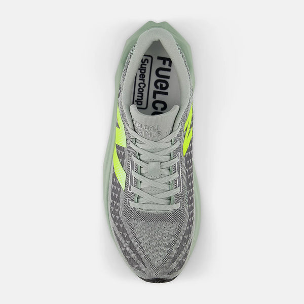 Gray and green sneaker with visible branding on a white background