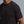 Man wearing a black t-shirt with 'Municipal' logo on a gray background