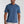 Man wearing a blue t-shirt with a white brand logo on a light gray background