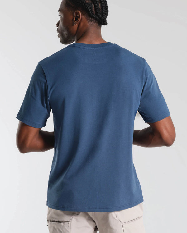 Person wearing a blue MUNICIPAL t-shirt on a plain background