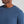 Man wearing a blue t-shirt with 'Municipal' logo on a gray background