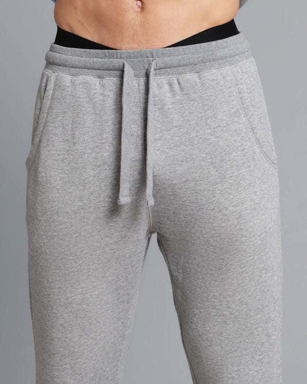Gray sweatpants with a drawstring on a gray background